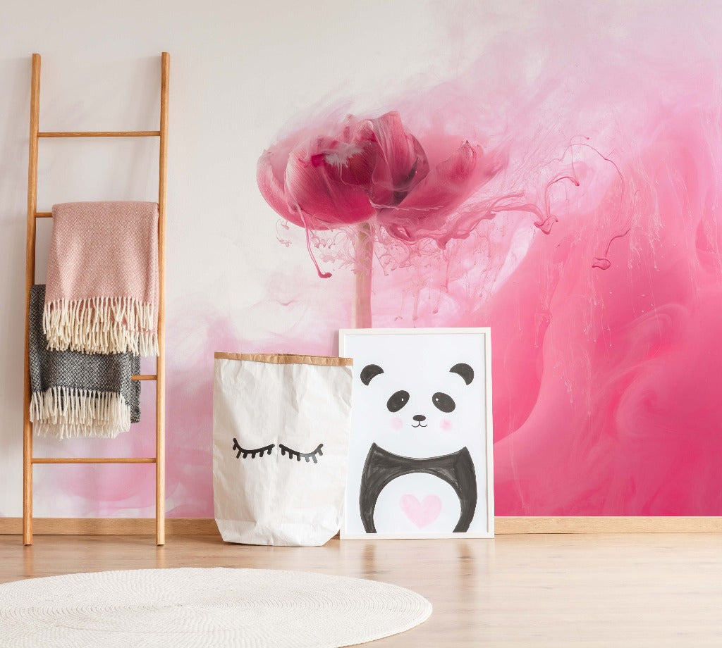 A cozy corner with a wooden ladder holding blankets, a canvas bag with eyelashes design, and a panda painting against a Decor2Go Wallpaper Mural.