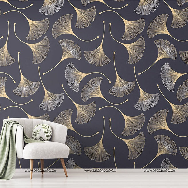 A stylish room with a white armchair, a green throw blanket, and a side table with plants against a dark blue wall featuring Decor2Go Wallpaper Mural.