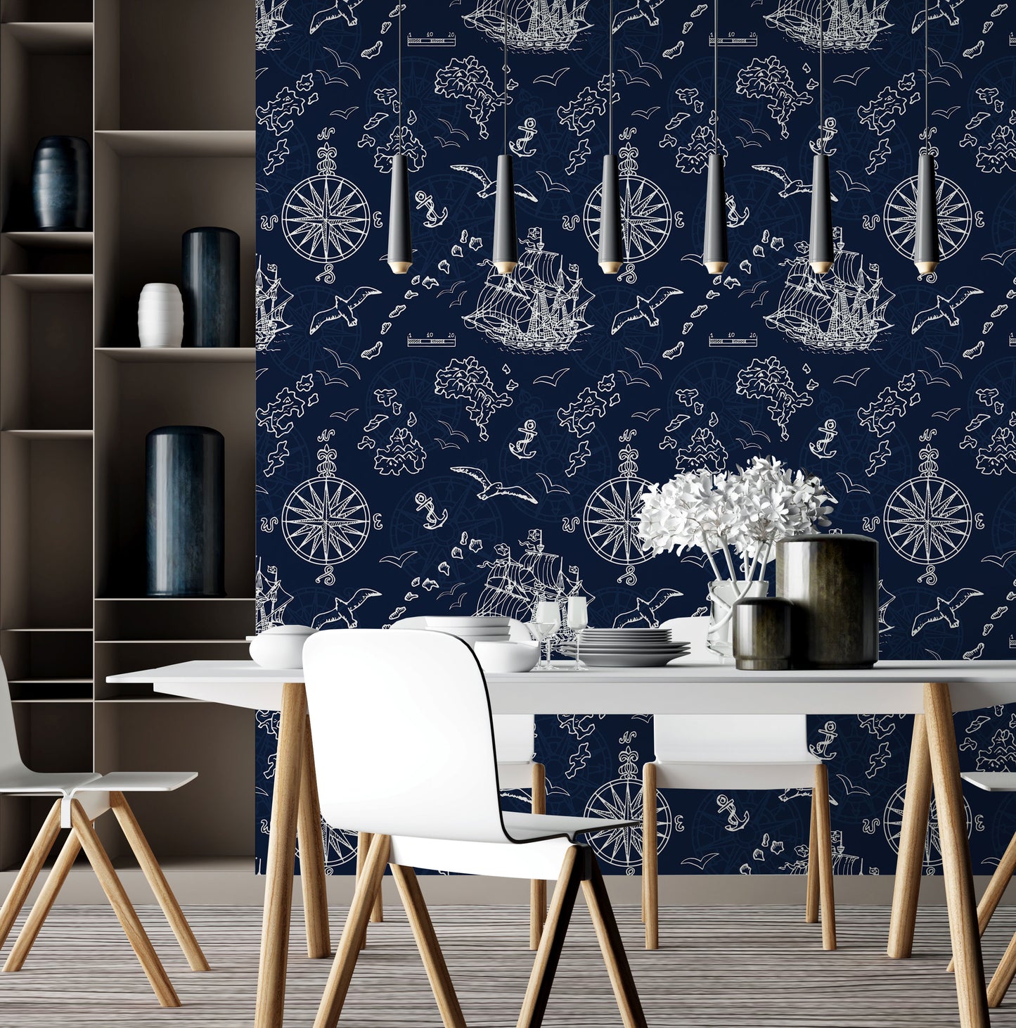 The modern dining room showcases a piece from Decor2Go Wallpaper Mural, the Nautical Treasure Adventure Wallpaper Mural, which enhances the space with its blue background and white ship illustrations. In the center, a white table and chairs are beautifully complemented by vases of fresh flowers, while pendant lights above contribute to the contemporary elegance of this stylish journey.