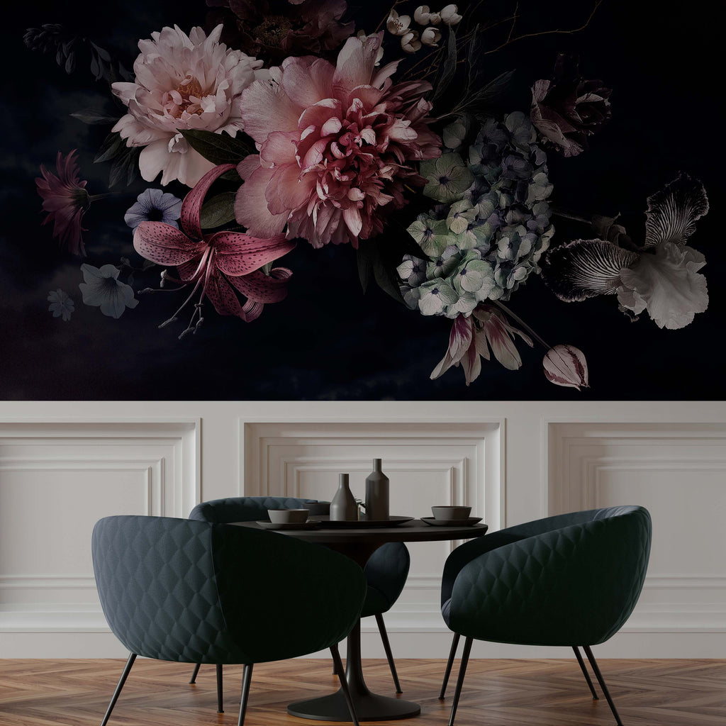 A dark-toned, elegant room featuring two green velvet chairs at a small round table, positioned on a hardwood floor against a classic white paneled wall, overlaid with a large, dramatic Peonies Over Black Wallpaper Mural from Decor2Go Wallpaper Mural.