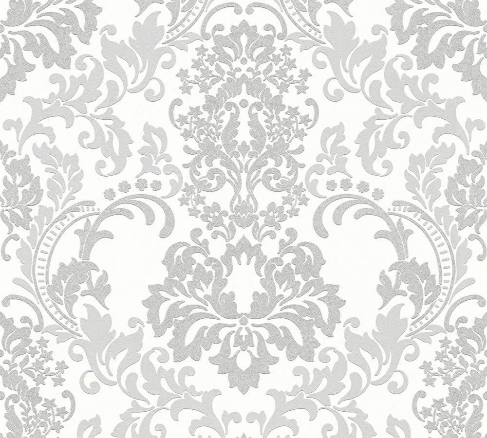 The White Baroque White and Light Grey Wallpaper by Ontario features an intricate, symmetrical damask pattern in shades of grey on a white background with ornate floral and leaf motifs. This textured wallpaper offers an elegant, classic look while being crafted from durable material.