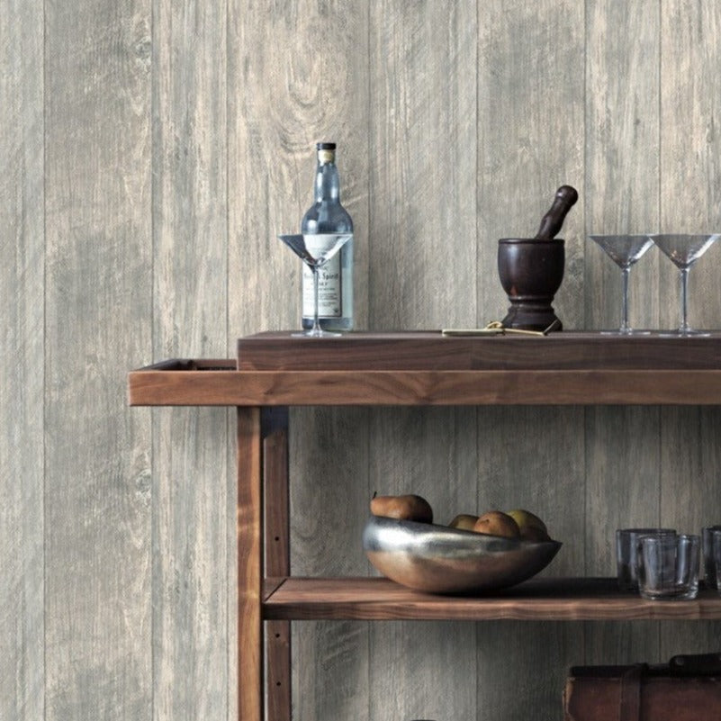 Grey rustic wood textured wallpaper on a wall