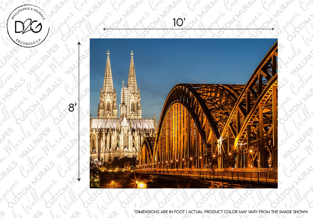 The image shows Cologne Cathedral and Hohenzollern Bridge illuminated at night, with the intricate European architecture of the cathedral contrasting the steel arches of the Decor2Go Wallpaper Mural.