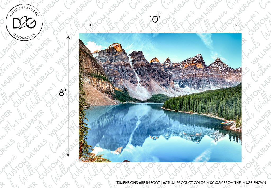 A framed Banff Panorama Wallpaper Mural from Decor2Go Wallpaper Murals featuring snow-capped mountains and a lush green forest reflecting in a serene blue lake. Dimensions and disclaimer notes are indicated.