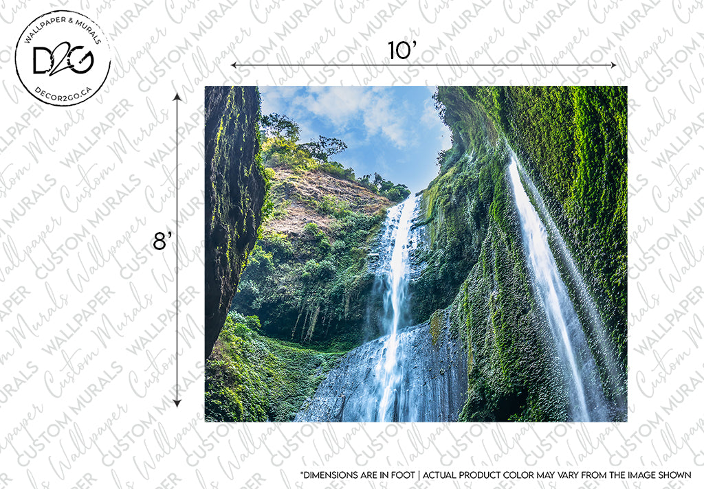 A scenic image of a majestic Indonesia waterfall mural cascading down a lush, moss-covered cliff under a bright blue sky, with dimensions labelled on a border indicating 10" and 8", featuring the Elevated Waterfall Wallpaper Mural from Decor2Go Wallpaper Mural.