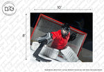 A hockey goalie dressed in red and black gear crouches in front of a net, ready to block a puck, on a Decor2Go Wallpaper Mural sample with dimensions noted.