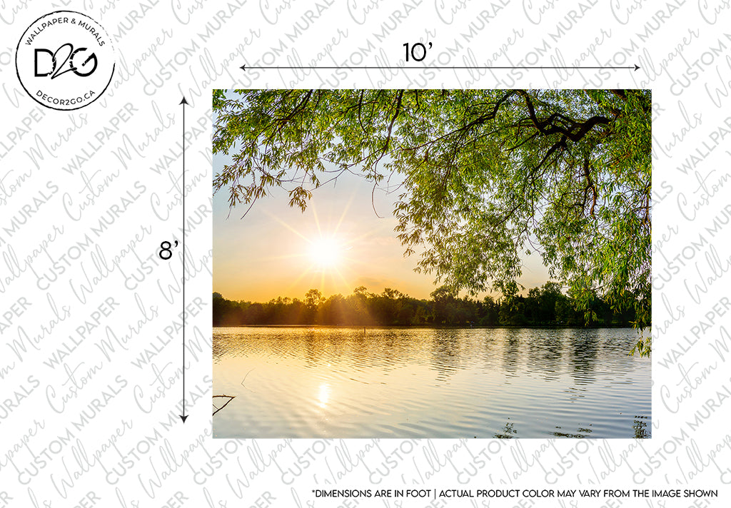 A serene sunset over a calm lake with the sun casting a warm glow on the water; a Lakeside Branches Wallpaper Mural from Decor2Go Wallpaper Mural at the top and lush greenery surrounding the scene creates a stress-free environment.