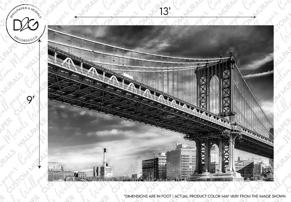 Black and white Decor2Go Manhattan Bridge Wallpaper Mural featuring the structure viewed from a side angle, showcasing its detailed suspension cables and arch. Watermarks and text overlays suggest sample product design.