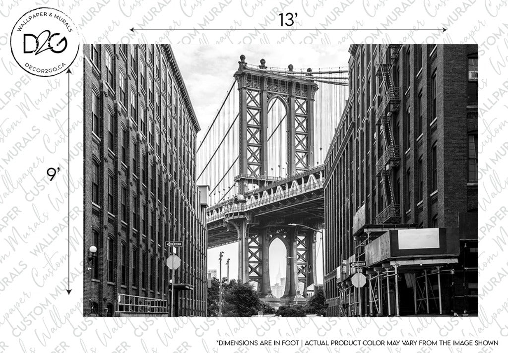 Sentence with replaced product: Black and white photo of the Manhattan Bridge viewed from DUMBO, Brooklyn, framed by two large buildings on either side. The New York Bridge Wallpaper Mural - Black and White by Decor2Go Wallpaper Mural features rich architectural design.