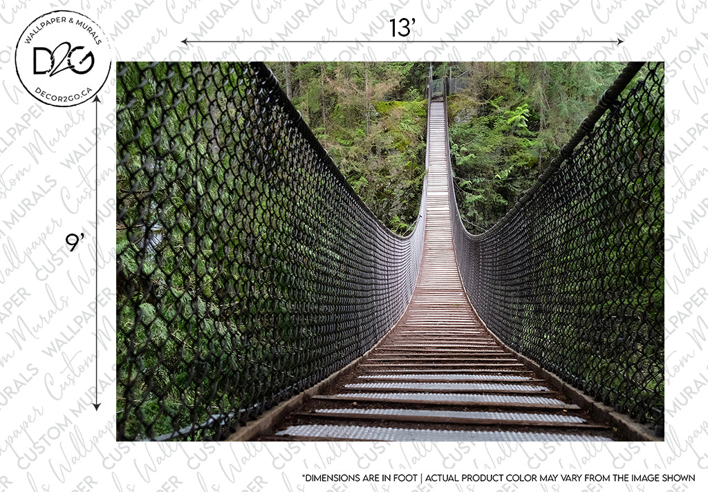 The Decor2Go Wallpaper Mural features a suspension bridge with a metal grid walkway stretching across a lush green forest. The bridge is enclosed by high mesh wire railings, and trees are dense on either.