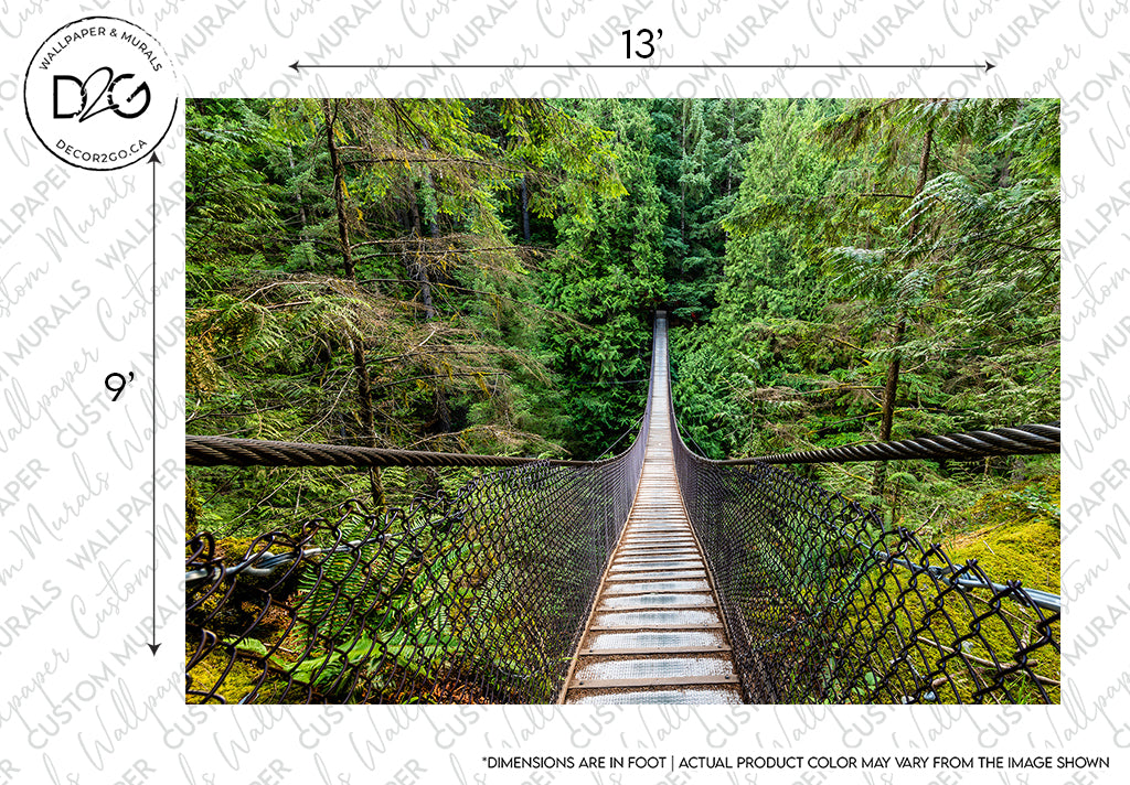 A narrow suspended wooden footbridge with metal chain-link sides stretches across a lush green forest, with dense foliage visible around and under the bridge. This scene is perfect for a Decor2Go Wallpaper Mural featuring the Forest Suspension Bridge design.