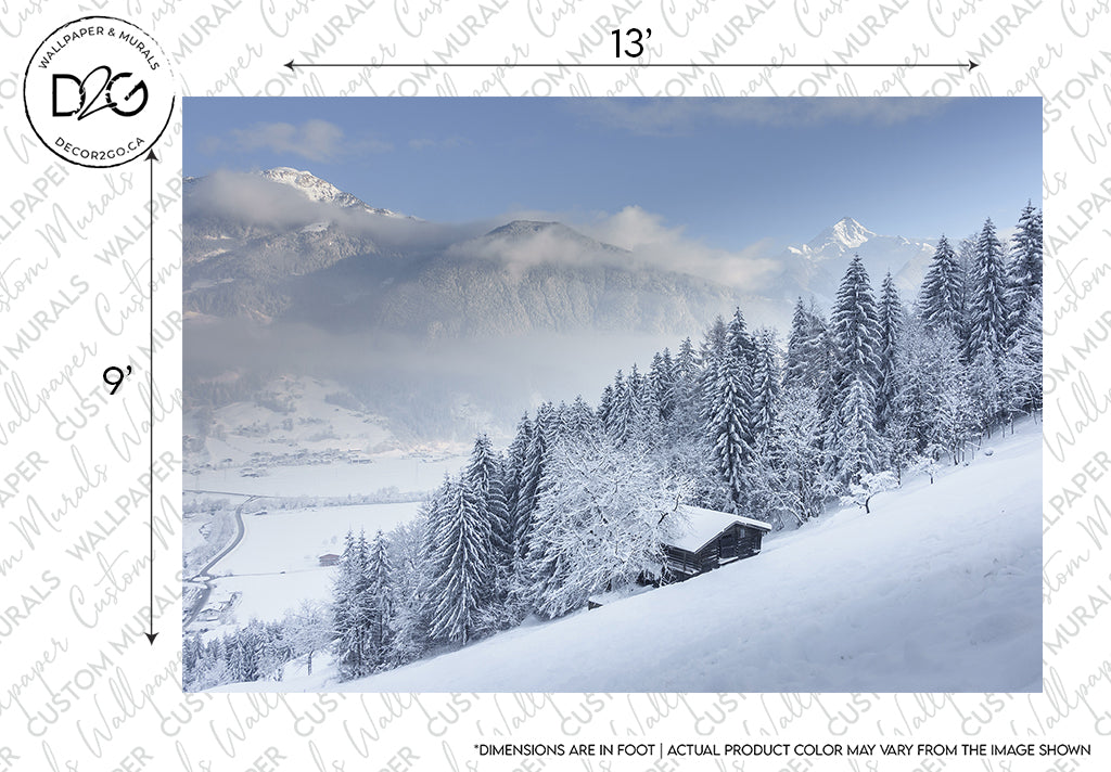 A serene Winter is Coming Wallpaper Mural by Decor2Go featuring a snowy hillside with trees, a small cabin, and distant mountains partially obscured by clouds. A watermark and measurement marks overlay the image.