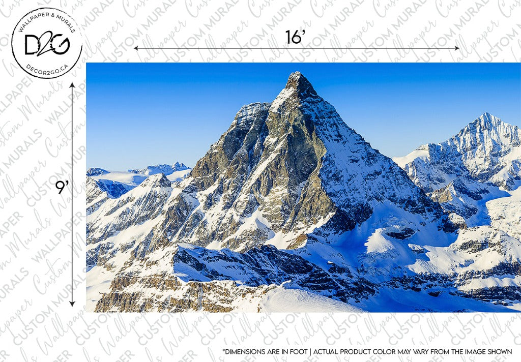 Image of a majestic snow-covered Matterhorn mountain range with blue skies above, marked with measurement lines indicating size, and a watermark that reads "Decor2Go Wallpaper Mural".