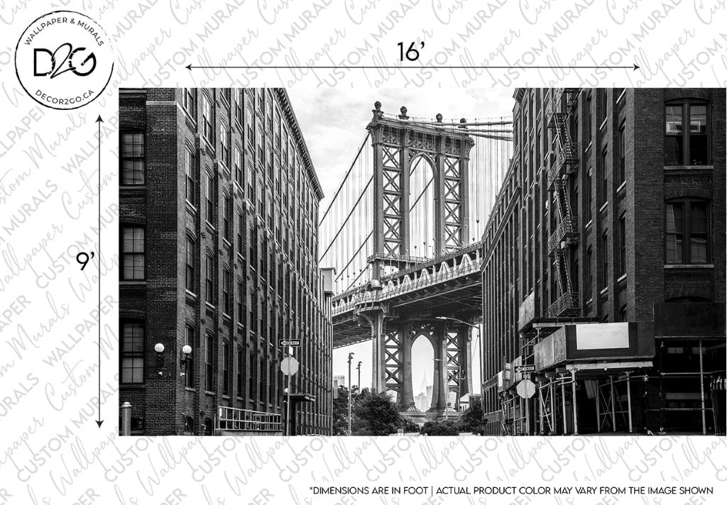 Decor2Go Wallpaper Mural New York Bridge Wallpaper Mural - Black and White, a New York landmark, viewed between two large buildings in a cityscape, showcasing detailed architectural features and urban design.