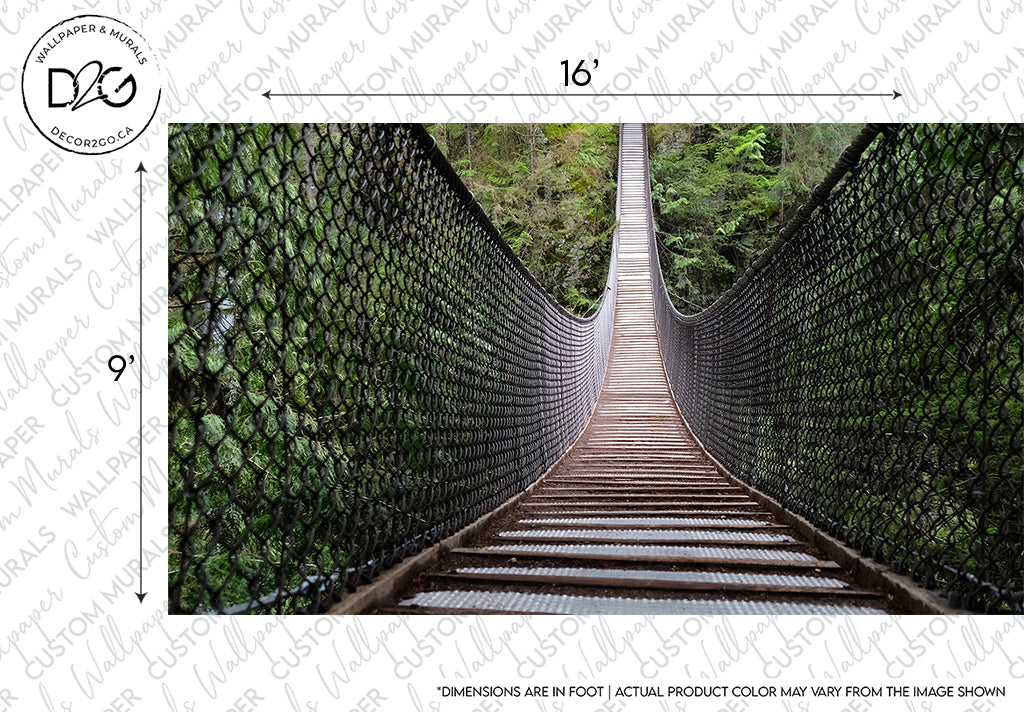 A narrow suspension bridge with a metal grate floor and mesh sides stretches across the Decor2Go Bridge Amid the Forest Wallpaper Mural, marked with dimensions "16 feet" wide and "9 feet" tall on the border.