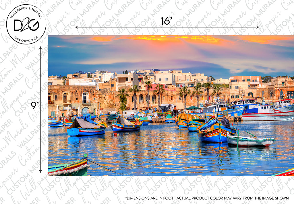 Colorful traditional boats on the water in front of a historic Mediterranean townscape with architectural design during sunset with soft clouds. A sample watermark and measurement indicators overlay the Decor2Go Wallpaper Mural Forever Malta Wallpaper Mural.