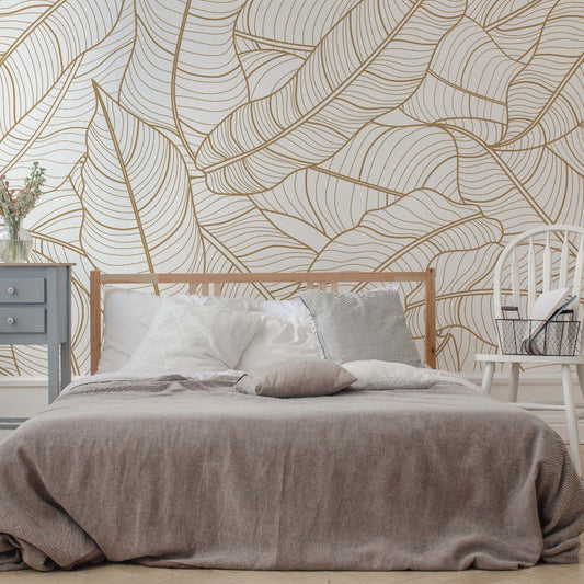 A cozy bedroom with a large Decor2Go Wallpaper Mural, featuring a bamboo bed frame with white bedding and a grey blanket, and a small white chair beside it.