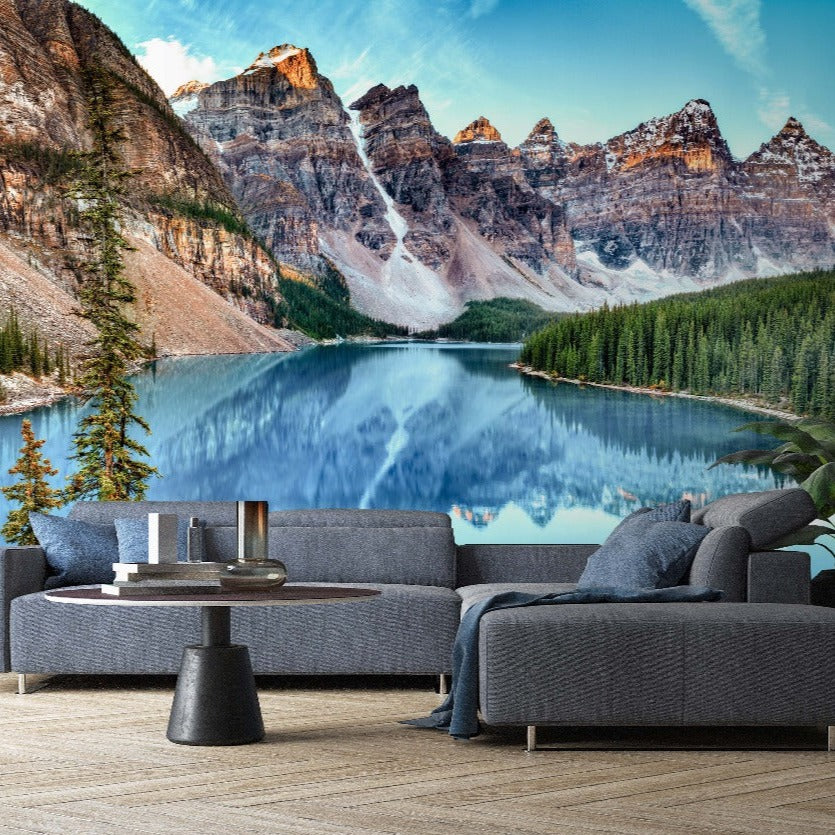 A modern living room featuring a gray sofa and coffee table set against a large feature wall with Decor2Go Banff Panorama Wallpaper Mural.