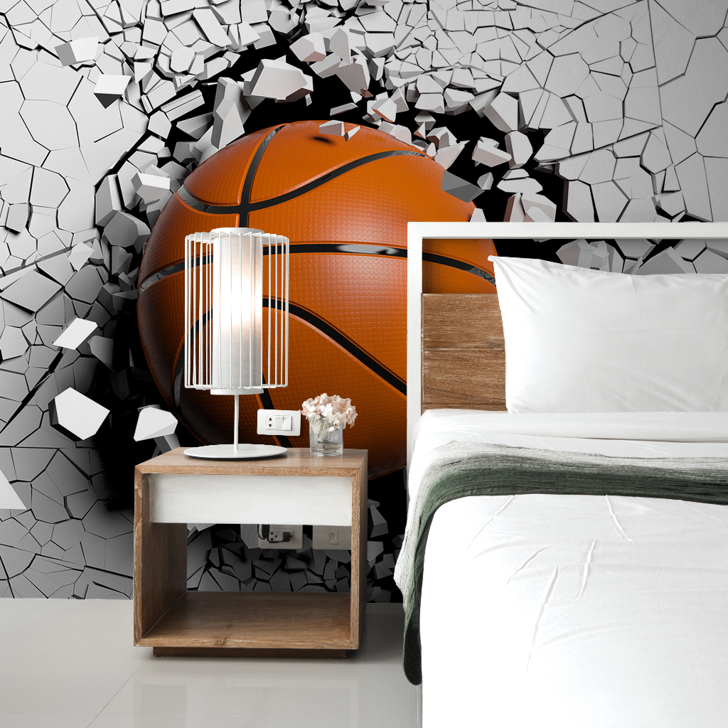 A 3D illustration of a large basketball breaking through a gray, shattered wall behind a modern bedroom setup with a simple bed and wooden nightstand, transformed into a Decor2Go Wallpaper Mural.
