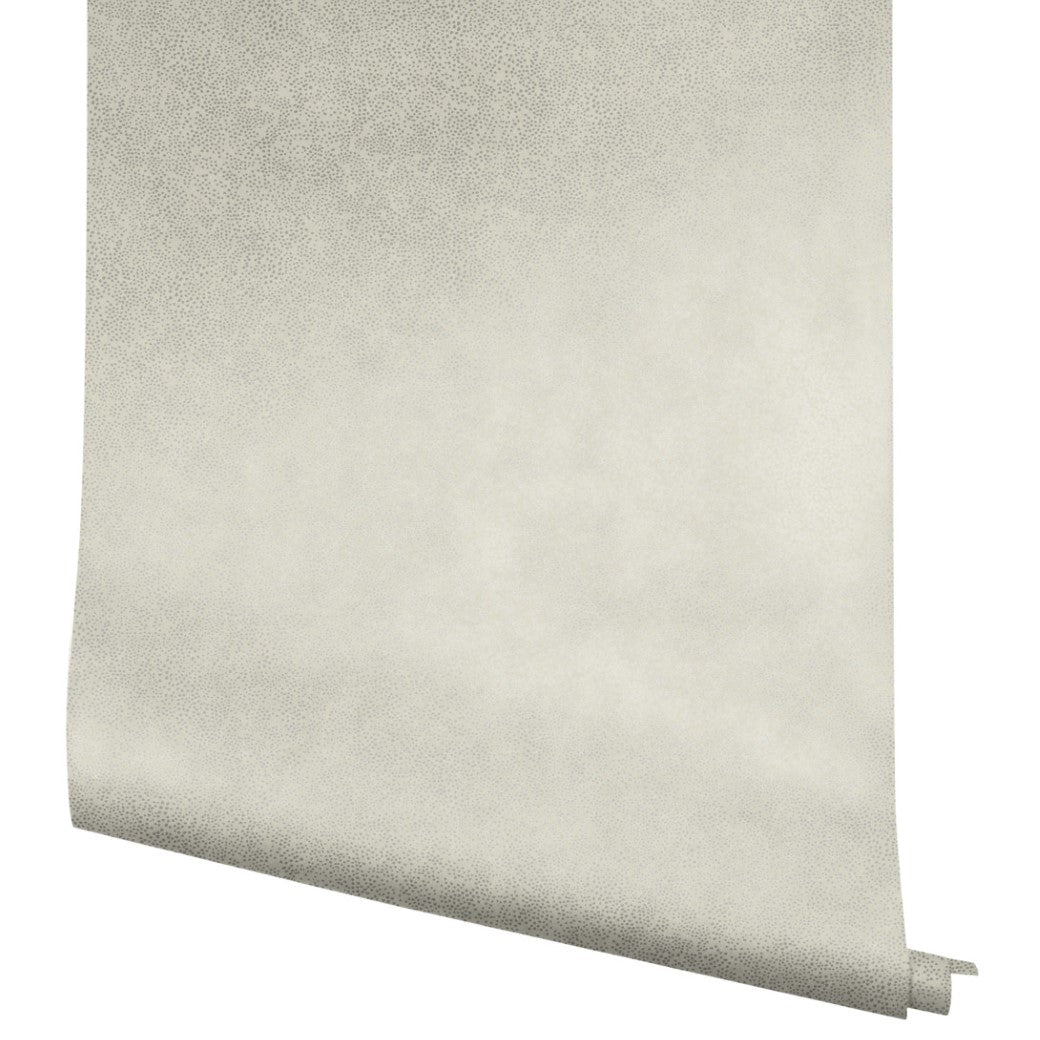 A partially unrolled roll of York Wallcoverings Beige Champagne Dots Wallpaper (60 SqFt) with a subtle, slightly textured dot pattern is displayed against a white background.