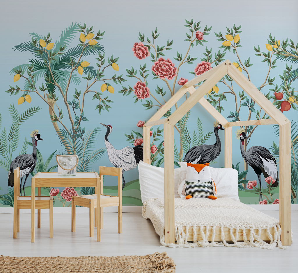 A cozy children's room with a house-shaped wooden bed frame, a small wooden table with two chairs, and vibrant Decor2Go Wallpaper Mural featuring floral and avian motifs.