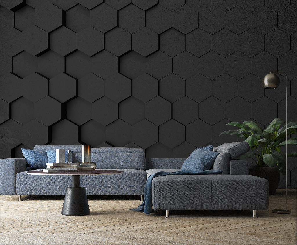 A modern living room featuring a navy blue sectional sofa against a Black Hexagons 3D Wallpaper Mural from Decor2Go Wallpaper Mural, with a round coffee table, brass wall lamp, and a green plant in the corner.