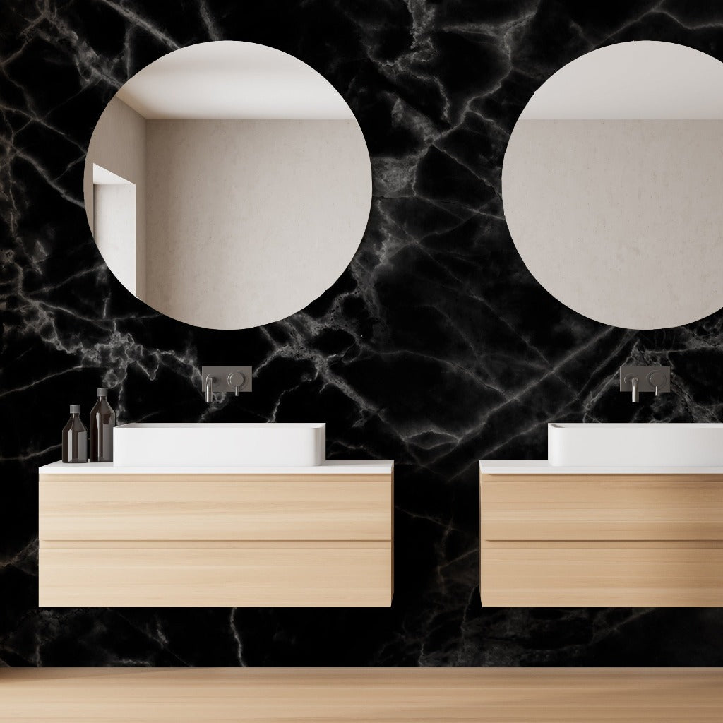 Modern bathroom interior with double sinks on wooden vanities against a Decor2Go Wallpaper Mural wall with two round mirrors. Luxurious visual impact and clean, elegant design.