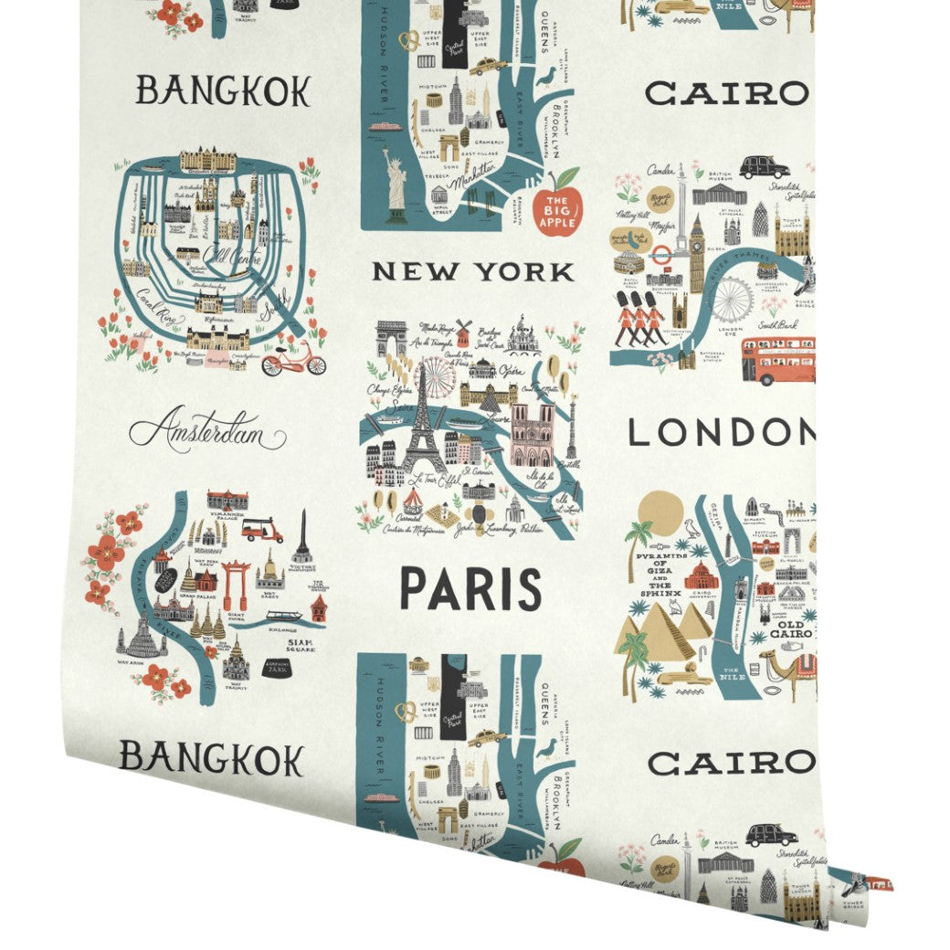 Blue/Red City Maps Wallpaper by York Wallcoverings (60 SqFt) features whimsical illustrations of Bangkok, New York, Cairo, Paris, London & Amsterdam—colorful travel wall decor with handwritten-style names inspired by Rifle Paper Co.