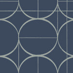 The York Wallcoverings Blue & Silver Sun Circles Wallpaper (60 SqFt) features a geometric pattern with large intersecting circles and straight lines in light blue against a dark blue background, evoking the elegance of Art Deco and the Modern Metals Collection.