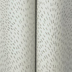A close-up of York Wallcoverings Dew Drop Grey Wallpaper (60 SqFt), featuring a pale blue-grey glitter finish.