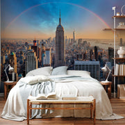 Bedroom - A bedroom with a large bed, book on the bench at its foot, and a Decor2Go Wallpaper Mural of New York City showcasing the stunning Double Rainbow Skyline over the skyline.