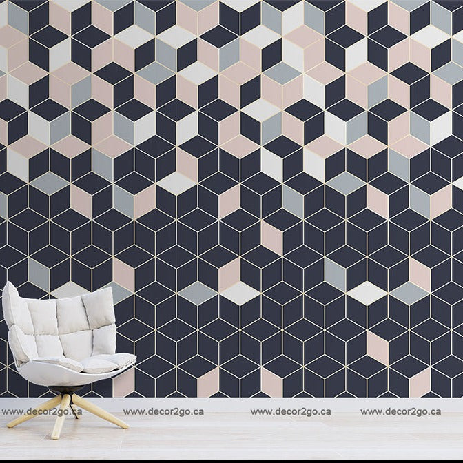A modern and stylish room with a Decor2Go Falling Cubes Wallpaper Mural in shades of blue, pink, and cream. The room also features a simple white chair with a light cushion and a small plant on a stool.
