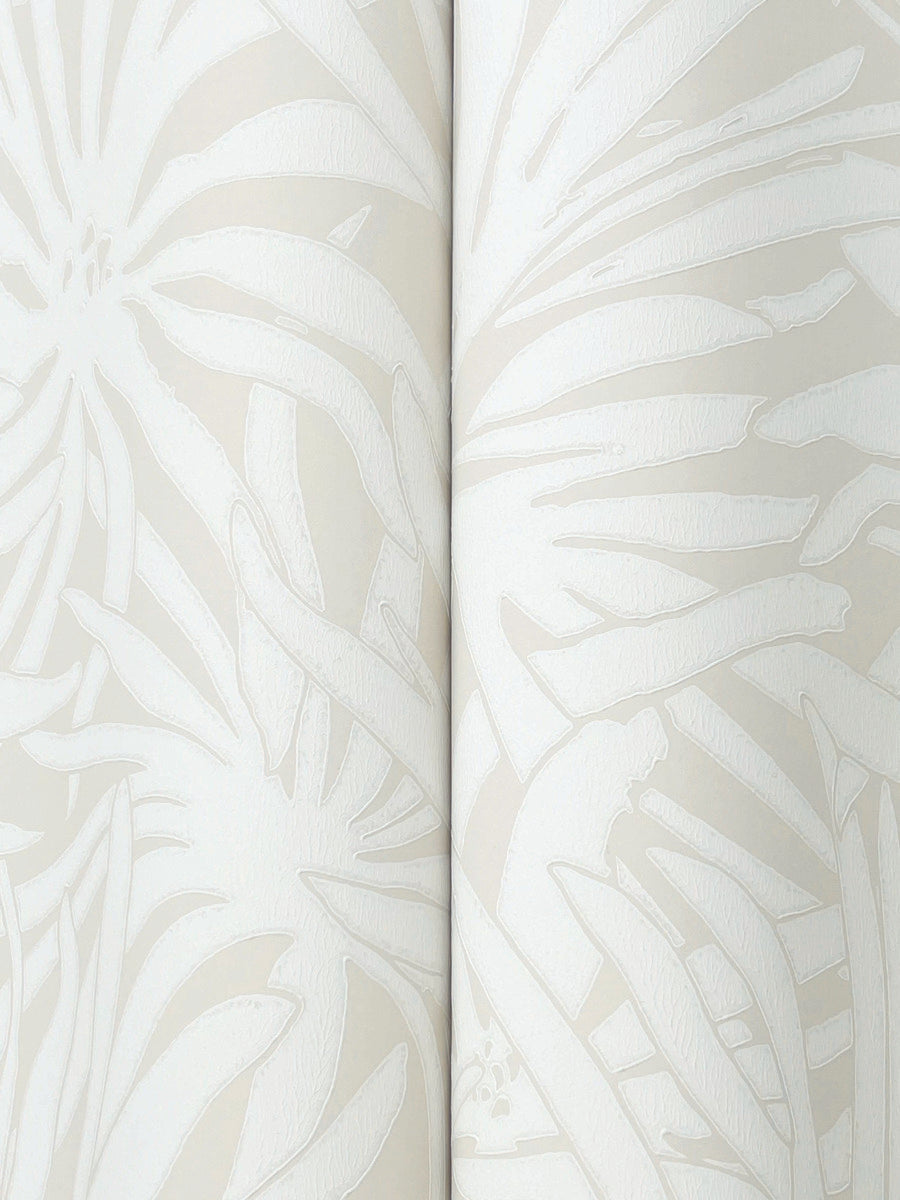 The Floral Canopy Cream Wallpaper by York Wallcoverings features a close-up of embossed floral and leaf patterns in light beige and cream, showcasing overlapping shapes and soft, textured details.