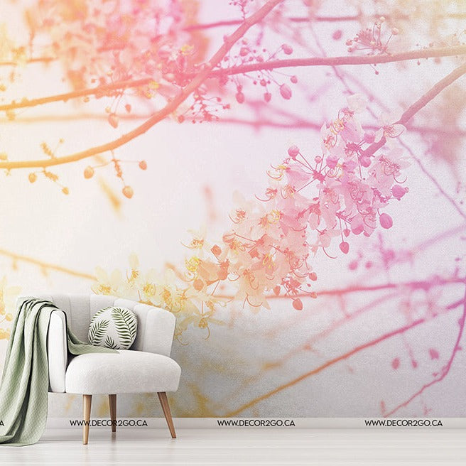 A serene interior scene featuring a stylish white chair with a throw and cushion next to a small table with a plant, set against a wall with vibrant Decor2Go Wallpaper Mural.