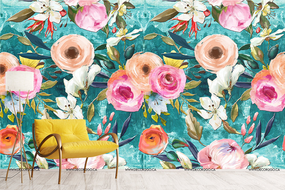 A vibrant interior room with a bold Decor2Go Wallpaper Mural featuring large pink and white flowers on a teal background, complemented by a bright yellow chair and a subtle white lamp.