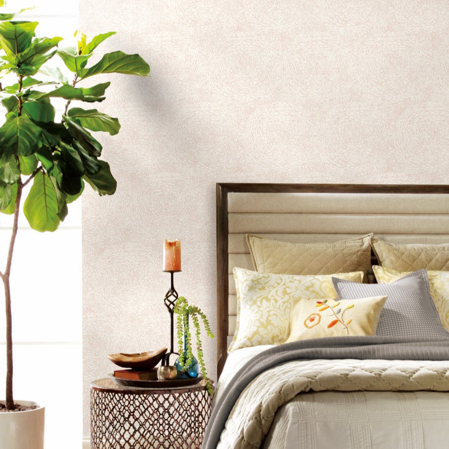 Natural boho bedroom furniture with pink floral design wallpaper