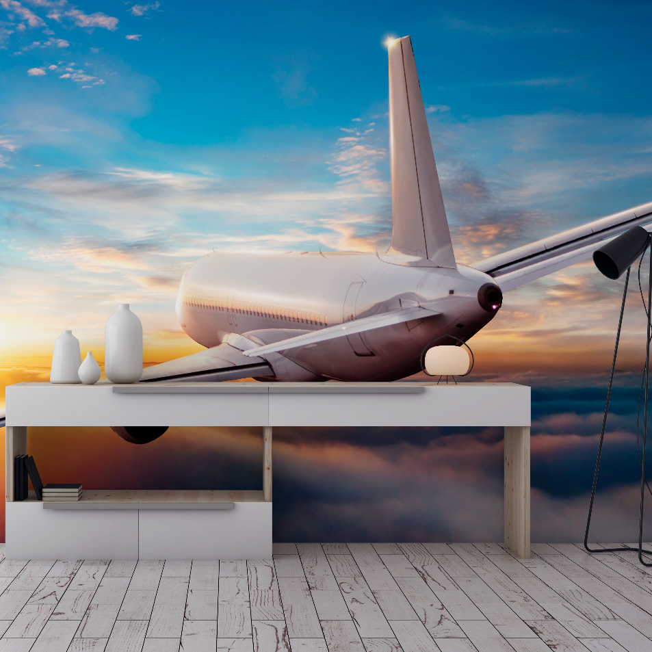 An artistic setting featuring a model airplane on a white shelf against a Decor2Go Wallpaper Mural of the Flying Above the Clouds, blending reality and art in a room with white flooring.