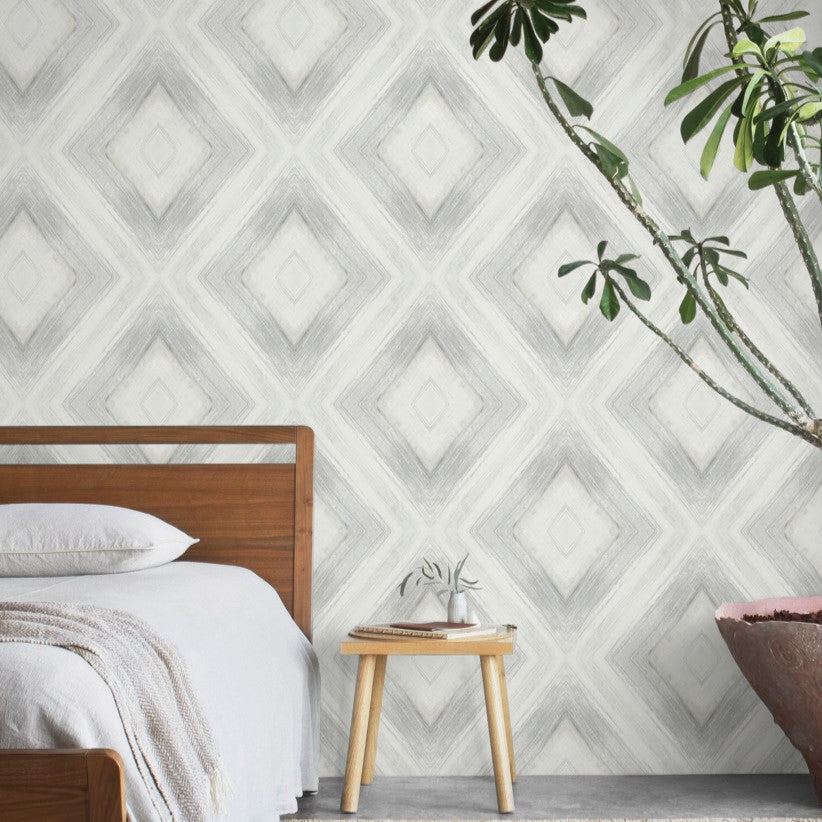 Natural boho bedroom furniture with diamond print wallpaper