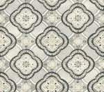 A geometric pattern features ornate diamond shapes containing intricate floral designs in shades of gray, beige, and white. The repeating motifs, reminiscent of the York Wallcoverings Garden Trellis Hazel Wallpaper Beige, Brown (60 Sq.Ft.), are bordered by leafy accents, creating a symmetrical and elegant decorative style.