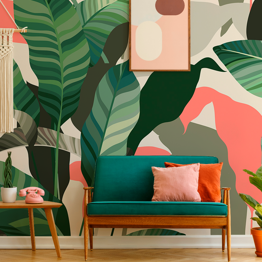 A stylish living room featuring a vibrant Decor2Go Wallpaper Mural with Colorful Tropical Leaves, pink flamingo accents, a teal sofa with pink cushions, abstract artwork, and small potted plants.