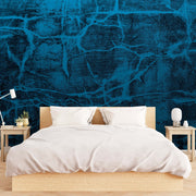 Bedroom - A minimalist bedroom featuring a wooden bed with white bedding, two bedside tables with lamps, and a vibrant blue Decor2Go Wallpaper Mural behind the bed.