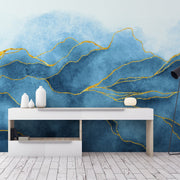 A minimalist room featuring a white console table with decorative vases, backed by Decor2Go Wallpaper Mural with gold accents, next to a black floor lamp, set on a white wooden floor.