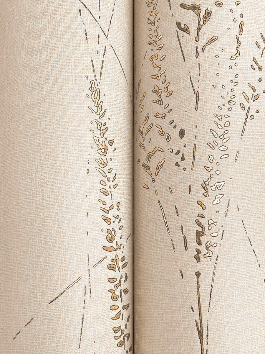 Close-up of Graceful Willow Pale Straw Wallpaper by York Wallcoverings, featuring a textured beige surface with a brown and gold wheat-inspired pattern positioned along a vertical seam.