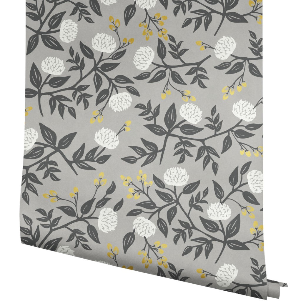 The York Wallcoverings Gray Peonies Wallpaper (60 SqFt) features a gray background with white flowers, dark gray leaves, and small yellow buds in a floral pattern.