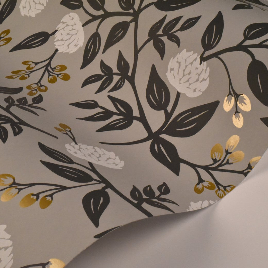 York Wallcoverings' Gray Peonies Wallpaper (60 SqFt) features a botanical design with dark branches, black leaves, white peonies, and gold accents on a light gray background; sheet is slightly curled at one corner.