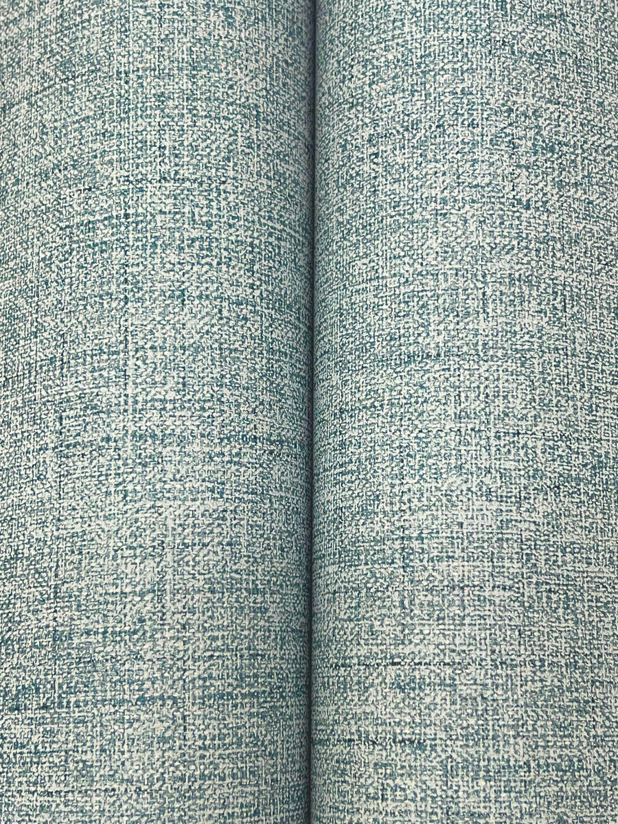 Close-up of two rolls of textured, indigo Hillswick Tweed Indigo Wallpaper by York Wallcoverings. This wallpaper features a subtle crosshatch pattern and linen-like texture inspired by classic menswear fabric. Coverage: 60 SqFt.