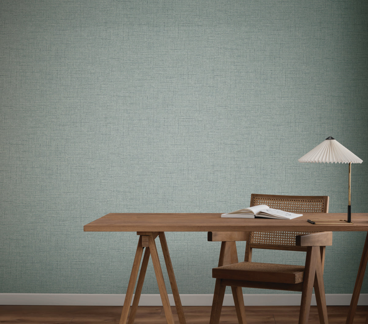 Home Office - A minimalist with a wooden desk, chair, book, and lamp features textured light blue Hillswick Tweed Indigo Wallpaper (60 SqFt) by York Wallcoverings, inspired by classic menswear fabric