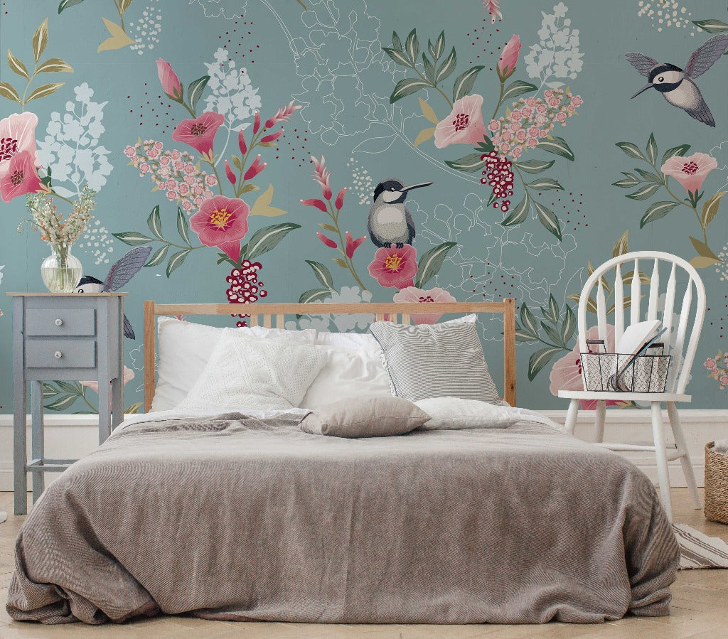 Bedroom - A cozy bedroom featuring a neatly made bed with gray bedding, set against a whimsical Decor2Go Wallpaper Mural with oversized floral designs, complemented by a light blue nightstand and a white wooden
