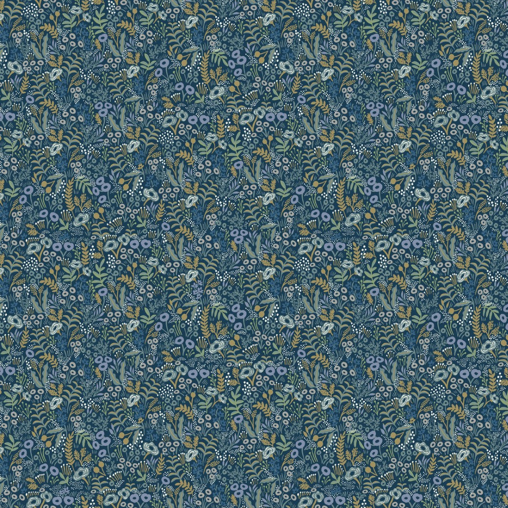 The Indigo Tapestry Wallpaper by York features an intricate botanical design of small blue, yellow, and white flowers with leaves on a dark blue background. The dense pattern creates a rich, classic tapestry-like appearance.