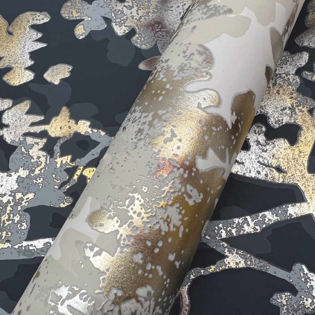 A close-up of York Wallcoverings' Khaki & Multi Shimmering Foliage Wallpaper (57 SqFt) reveals abstract patterns with metallic gold and bronze accents on a dark background, featuring organic shapes and textures for a dynamic artistic look.